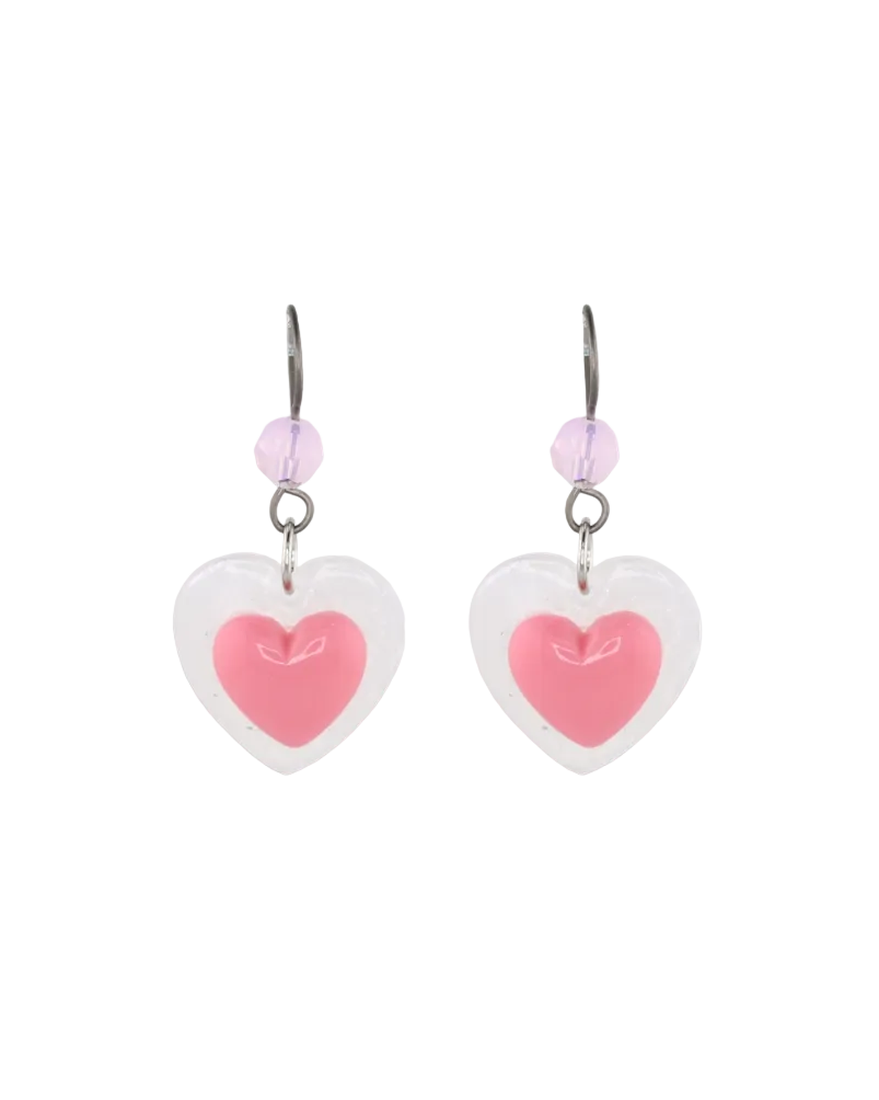 A pair of earrings featuring pink heart-shaped pendants with a white outline and small crystal accents.