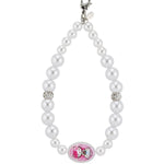 Pearl phone wristlet with a Hello Kitty x Tarina Pink Head charm 